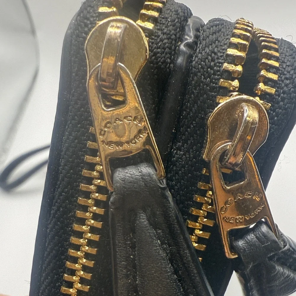 Coach signature‎ Brown Wristlet with Black and gold Accents